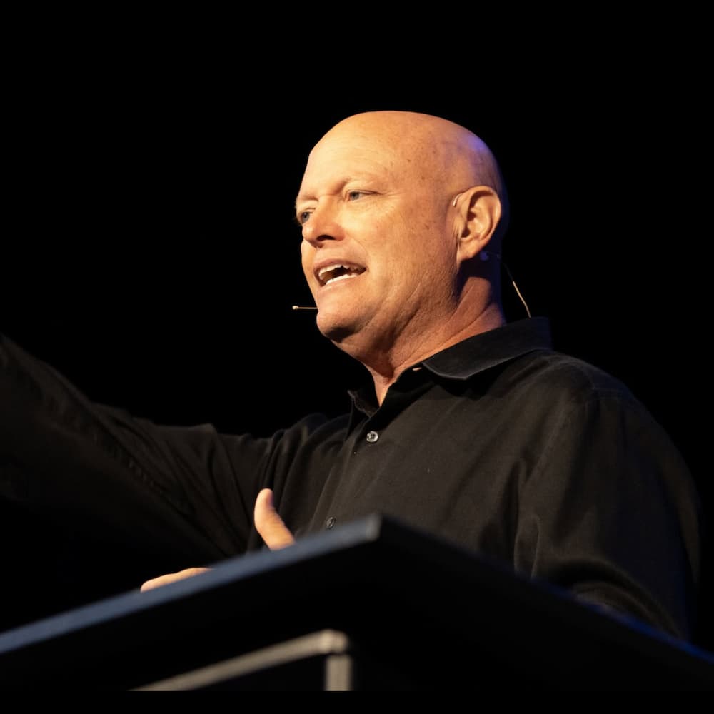 Todd Braschler speaking on stage
