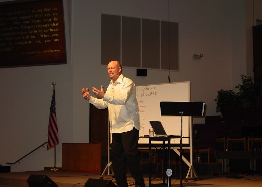 Todd Braschler speaking to crowd on stage